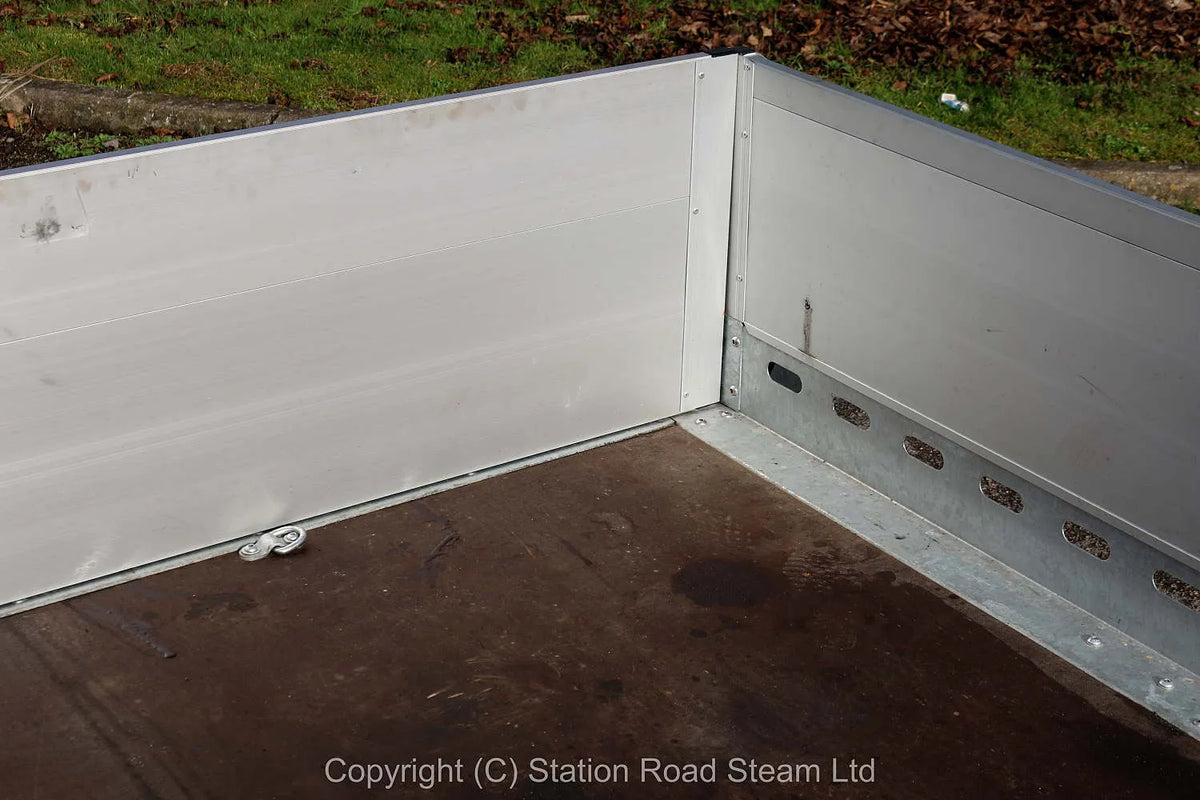 Two wheel tilt bed trailer