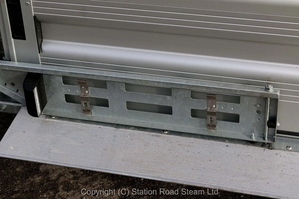 Two wheel tilt bed trailer