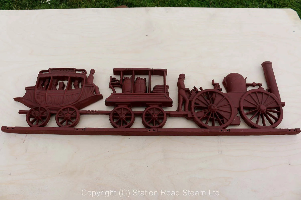 Cast iron wall plaque of early train