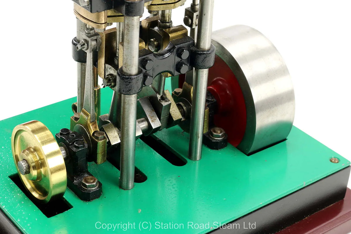 Vertical twin engine with marine flywheel