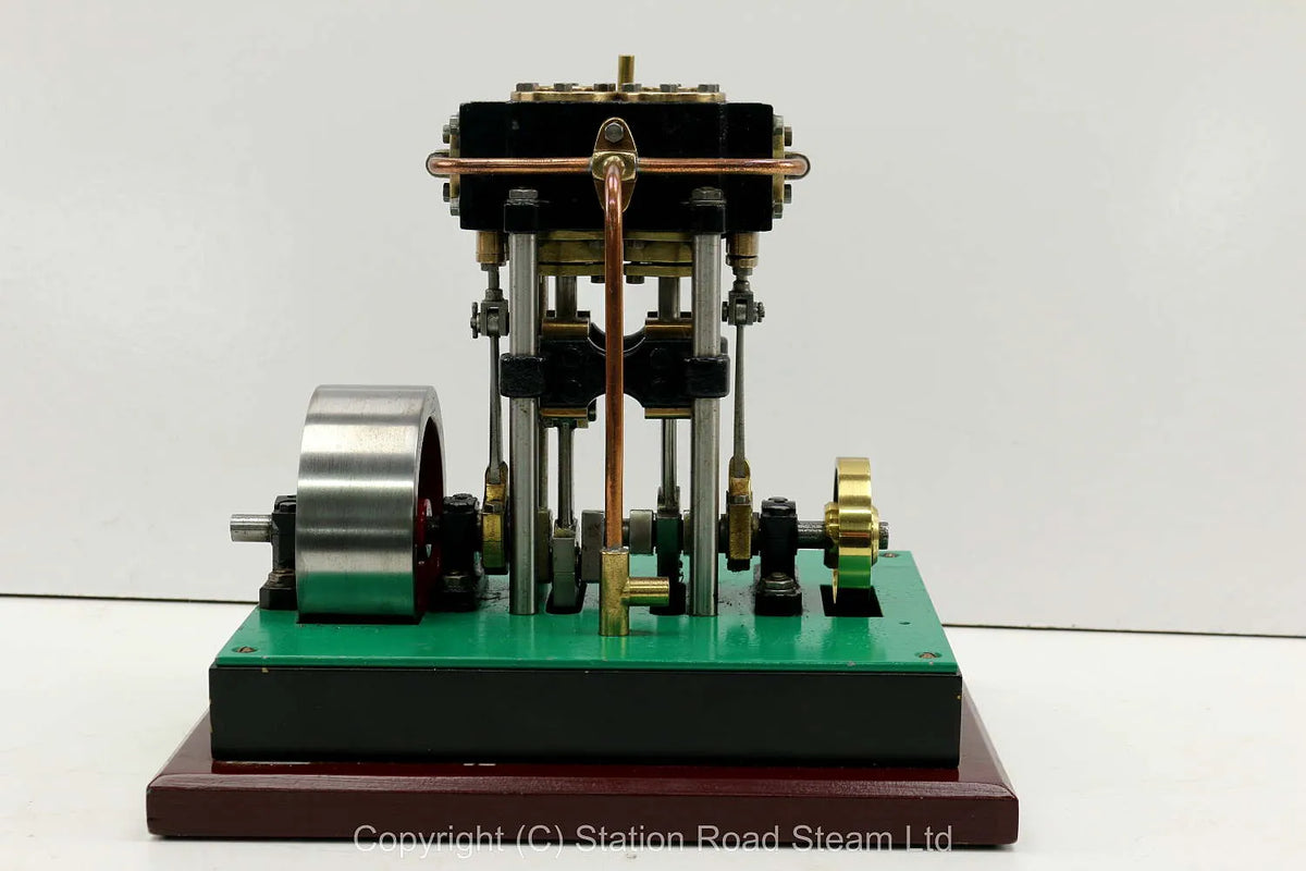 Vertical twin engine with marine flywheel