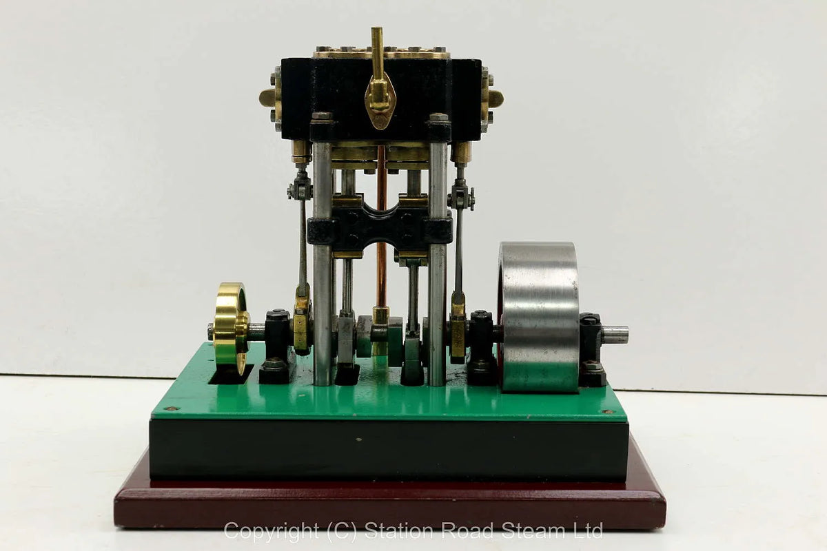 Vertical twin engine with marine flywheel