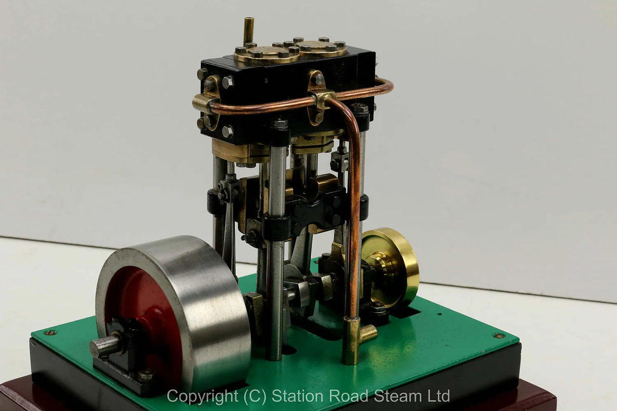 Vertical twin engine with marine flywheel