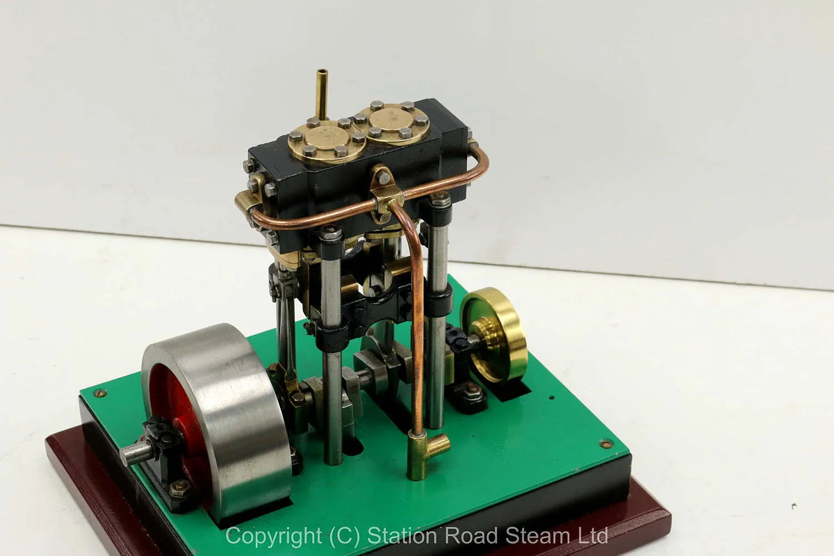 Vertical twin engine with marine flywheel
