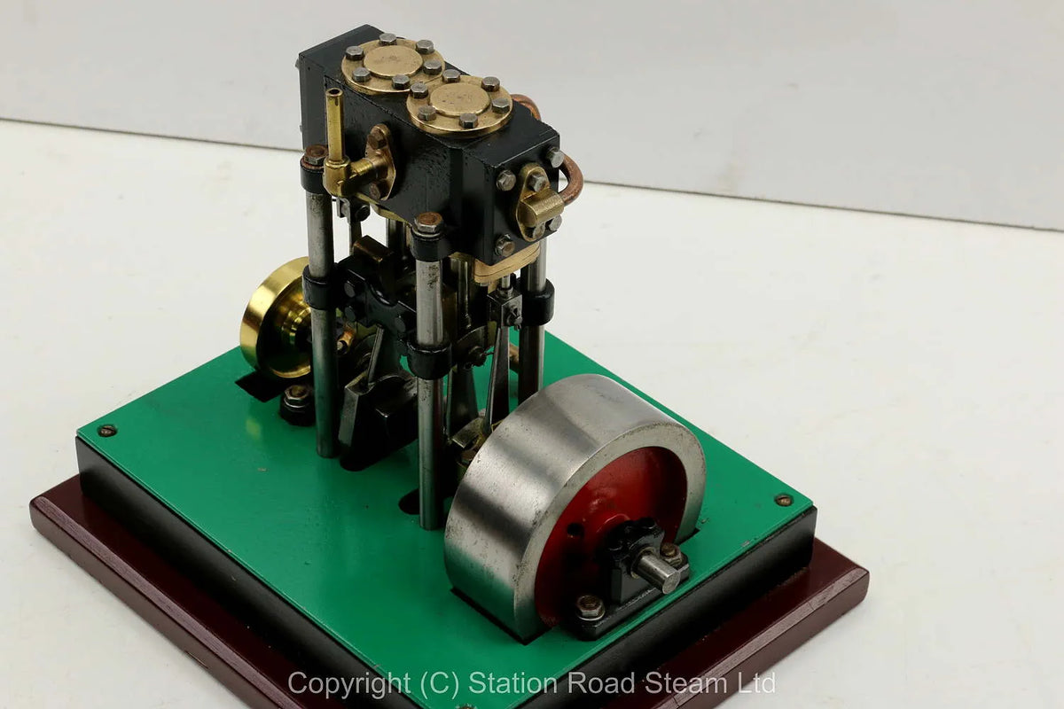 Vertical twin engine with marine flywheel