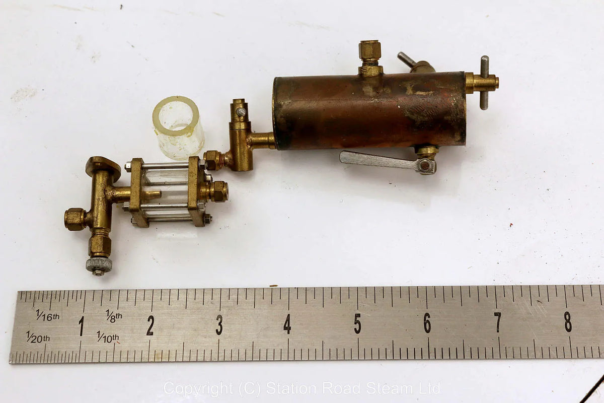 Displacement lubricator with sight feeder