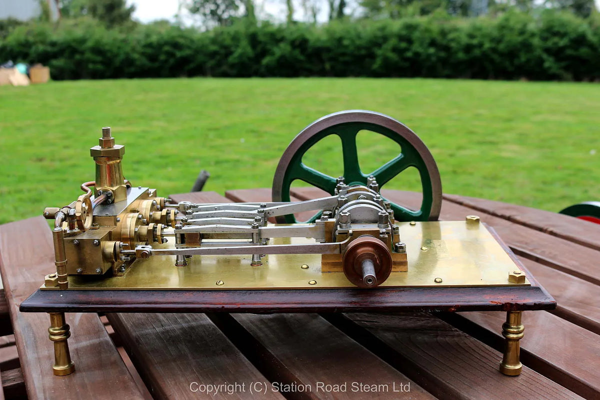 Horizontal twin mill engine on brass supports with hardwood base