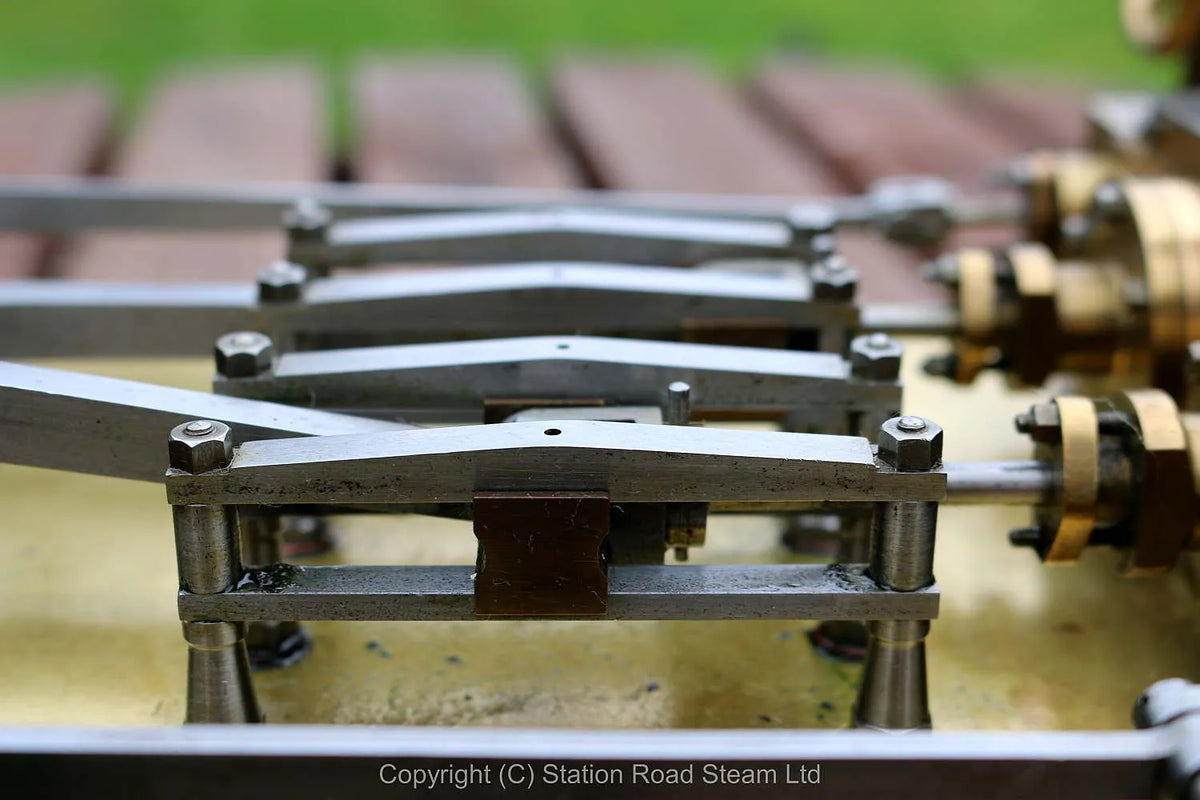 Horizontal twin mill engine on brass supports with hardwood base