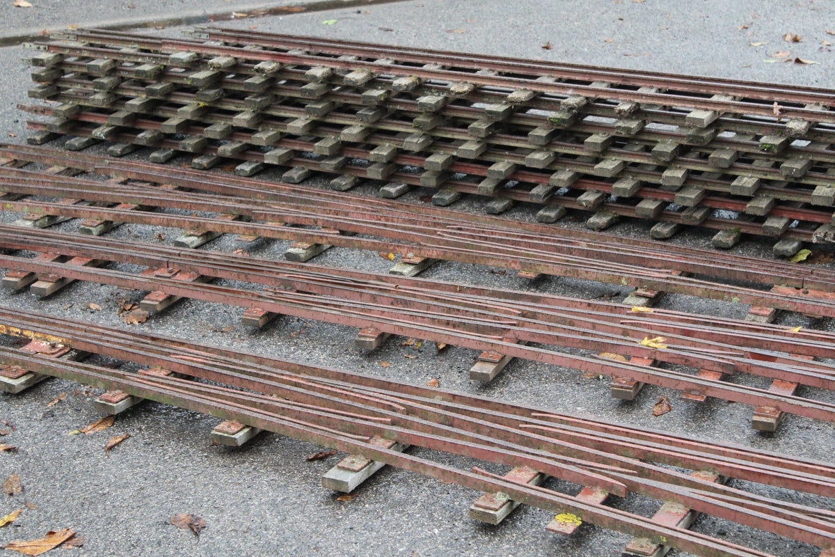 Three 5 & 7 1/4 inch multi-gauge turnouts & track panels