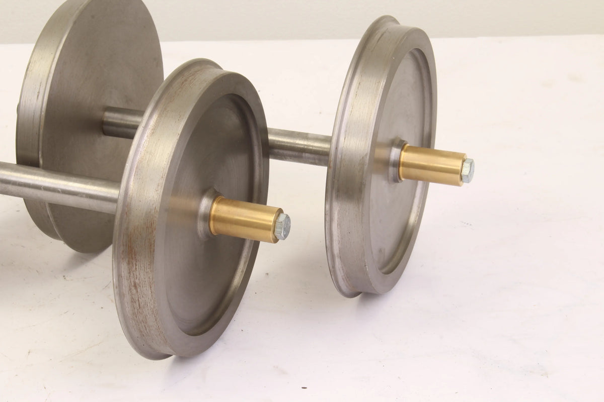 Four 7 1/4 inch narrow gauge wheelsets