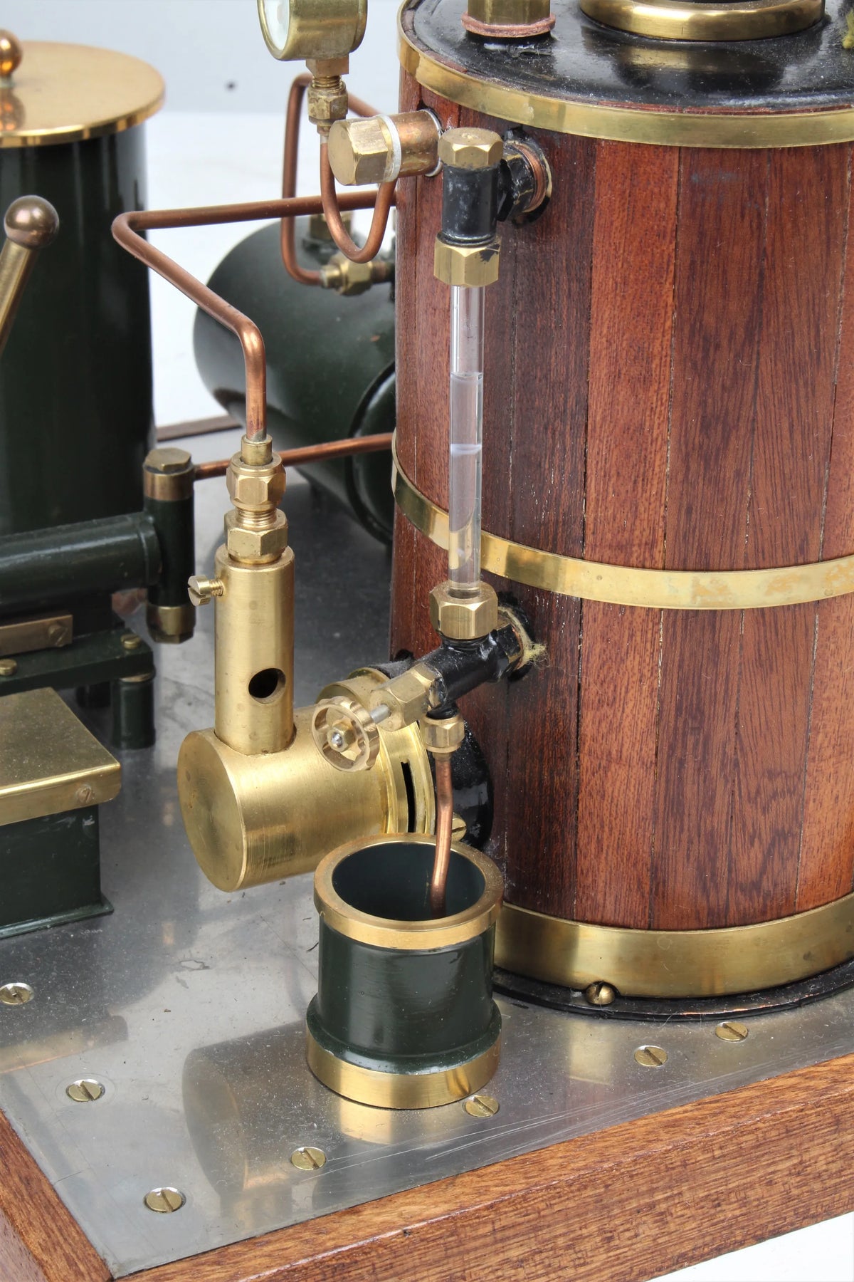 Gas-fired vertical boiler with hand pump and water tank