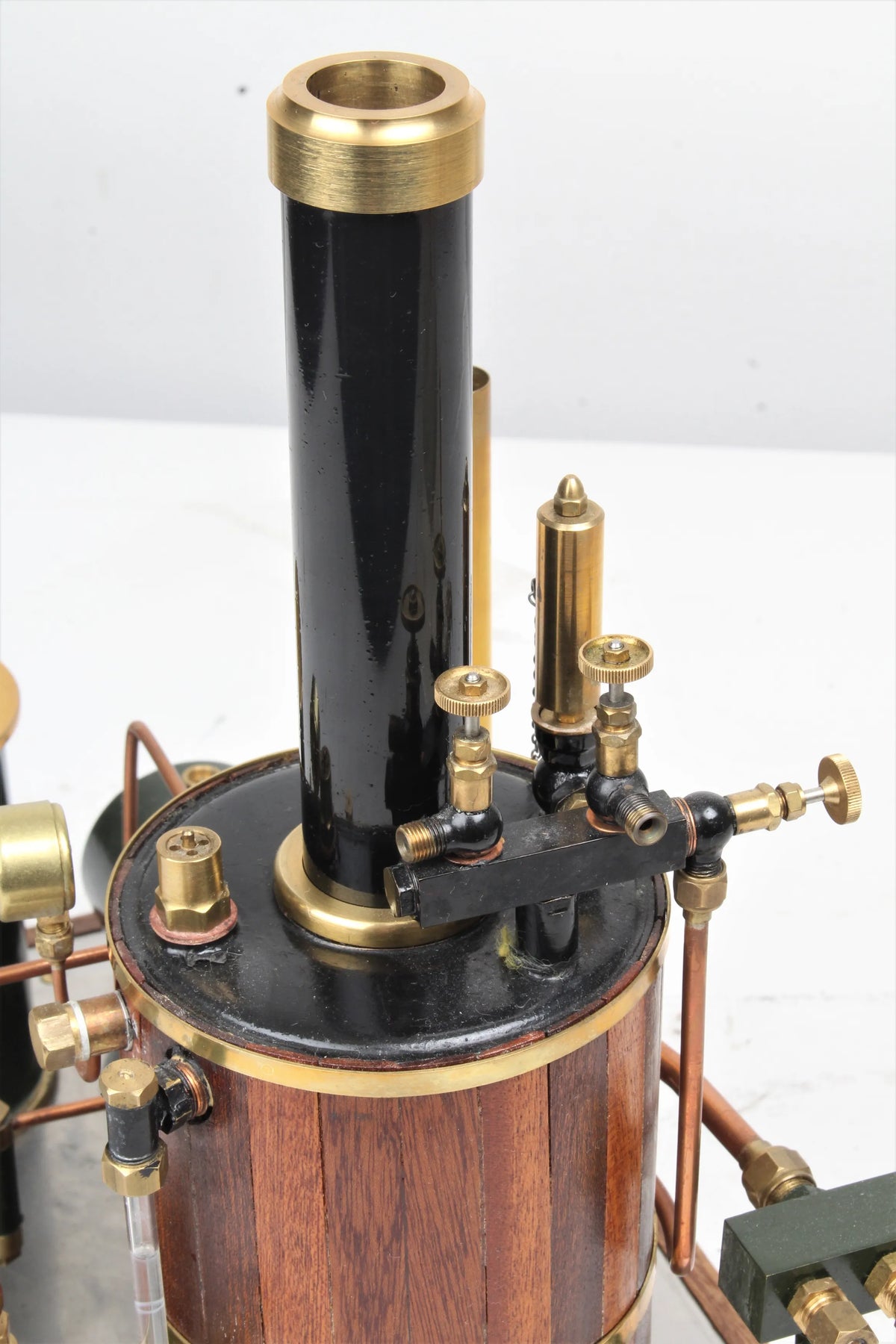 Gas-fired vertical boiler with hand pump and water tank