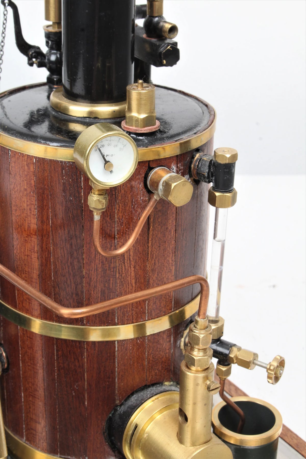 Gas-fired vertical boiler with hand pump and water tank
