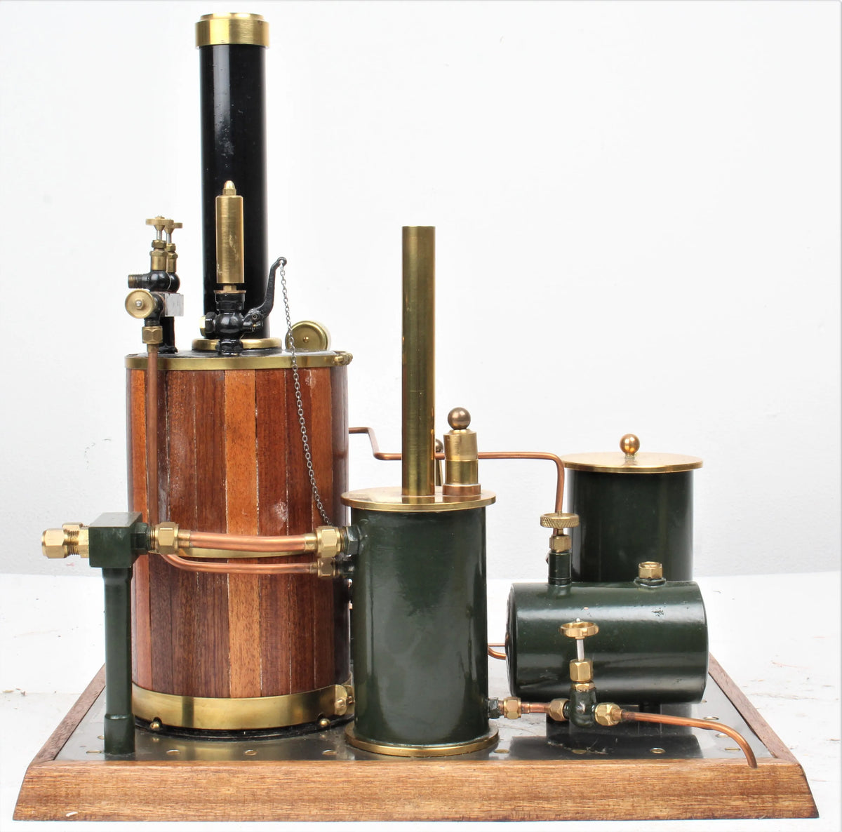 Gas-fired vertical boiler with hand pump and water tank