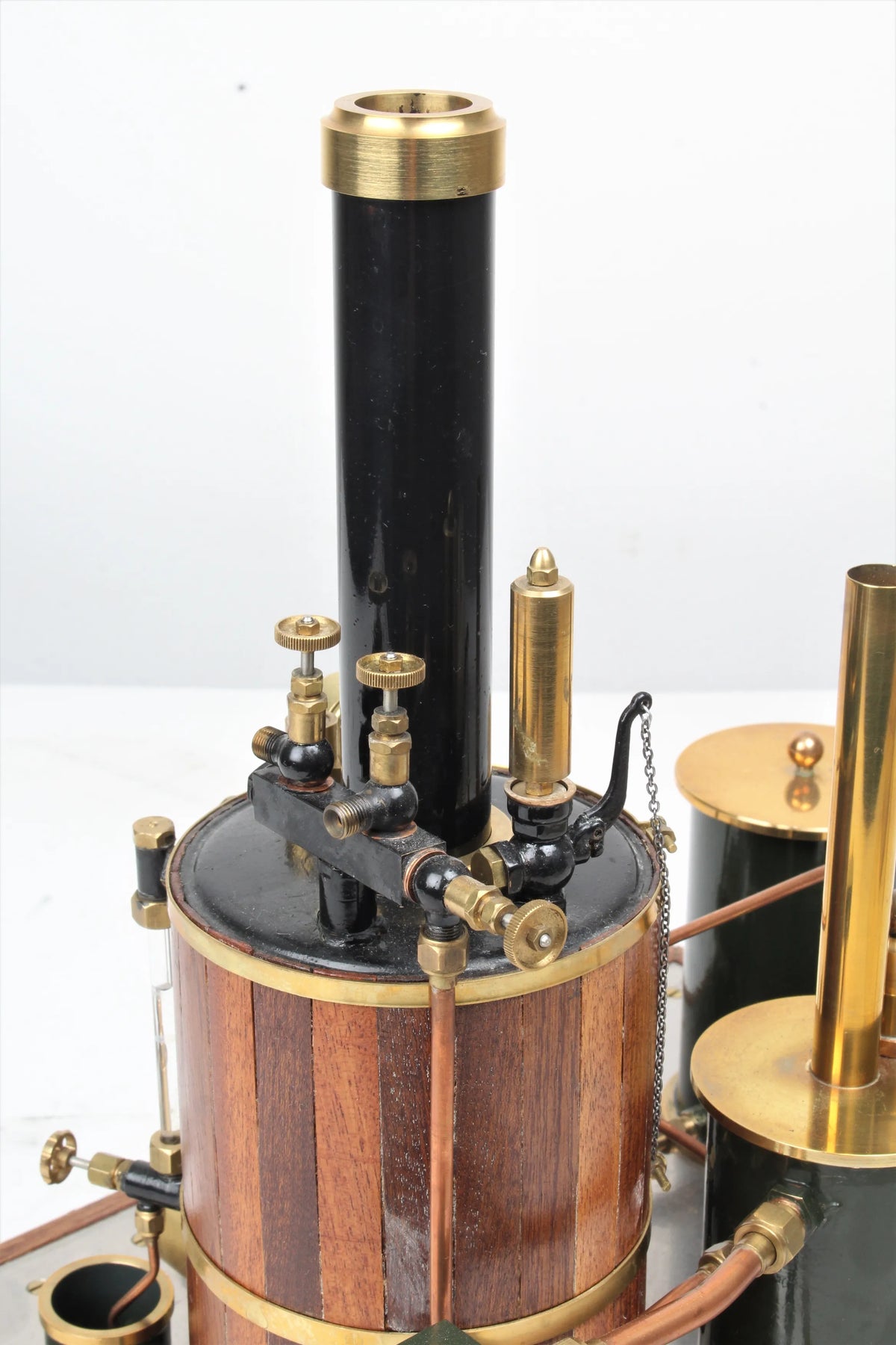 Gas-fired vertical boiler with hand pump and water tank