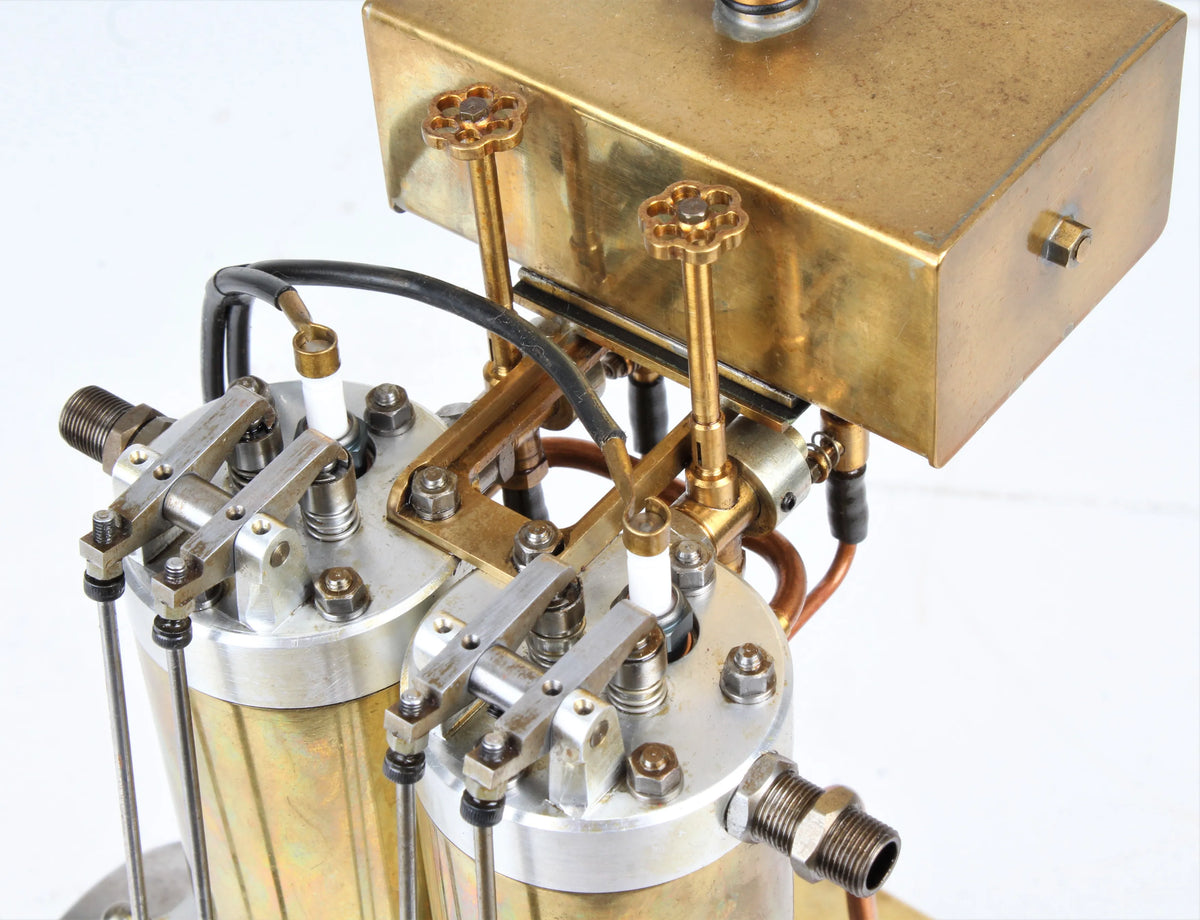 Open crank vertical twin internal combustion engine