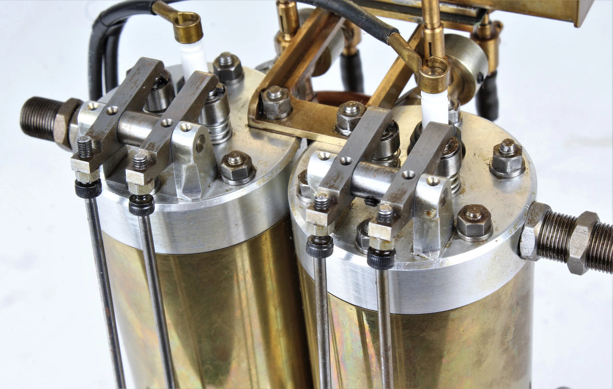 Open crank vertical twin internal combustion engine