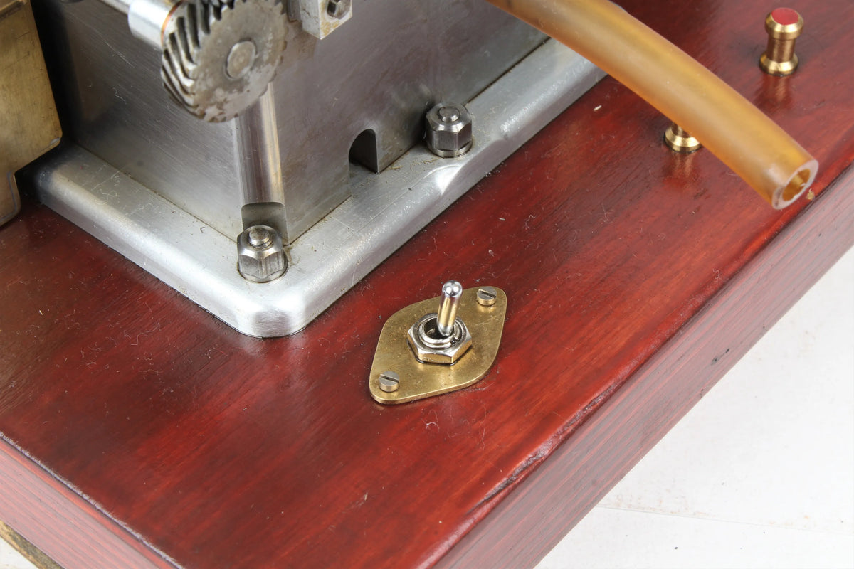 Open crank vertical twin internal combustion engine