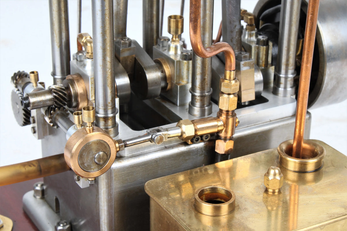 Open crank vertical twin internal combustion engine