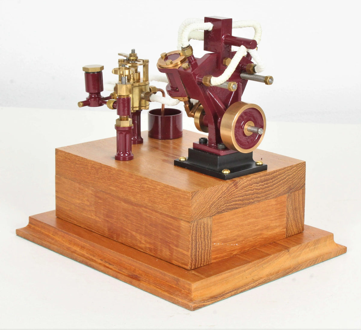 Twin oscillating engine on oak plinth