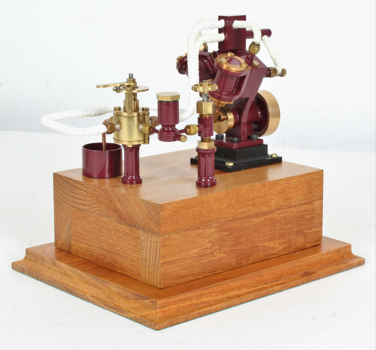 Twin oscillating engine on oak plinth