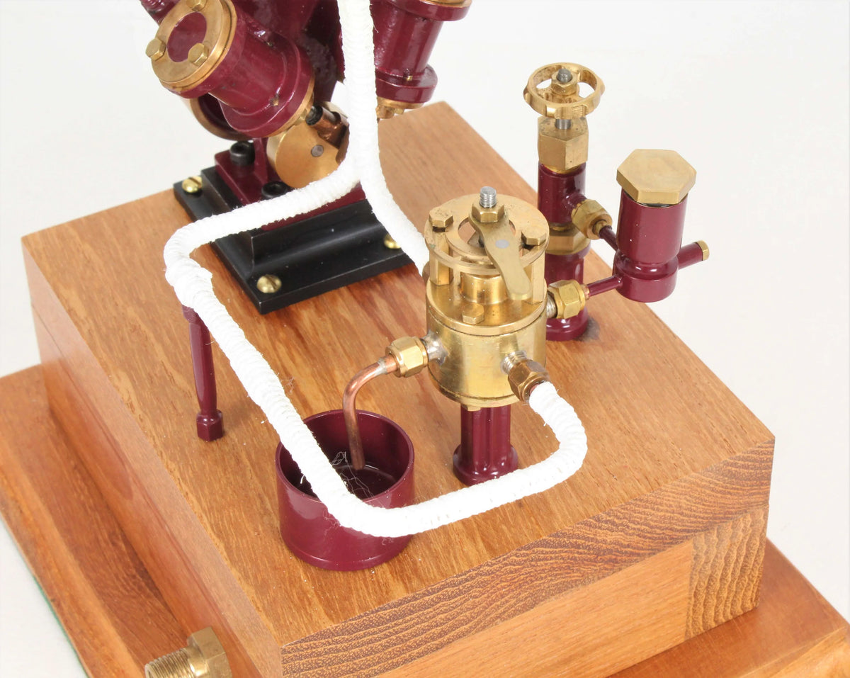 Twin oscillating engine on oak plinth